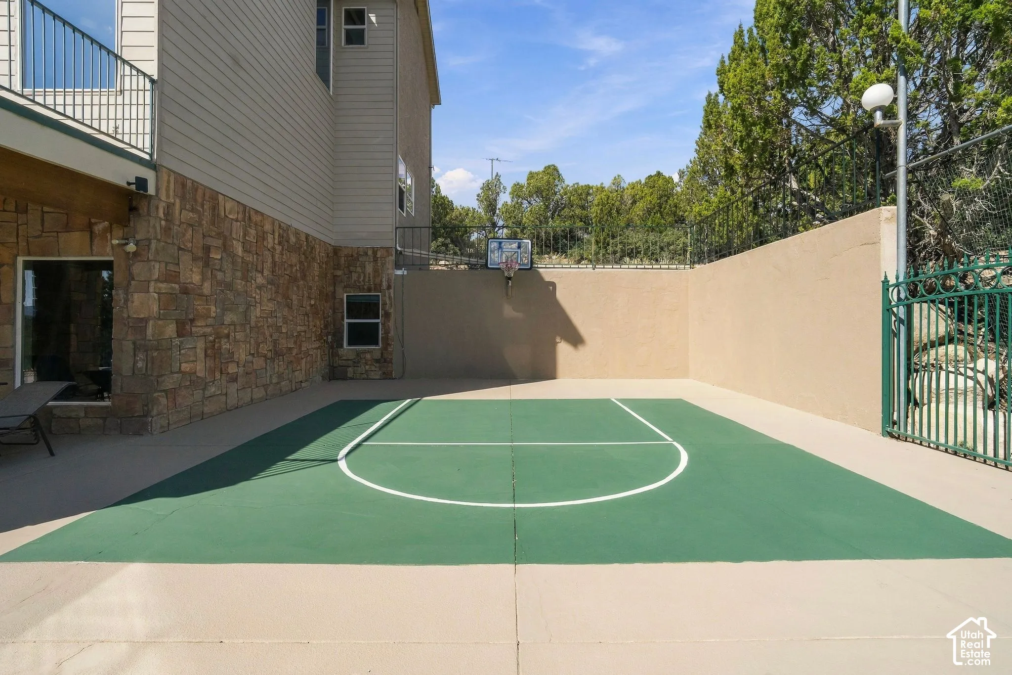 Dedicated sports court featuring a regulation-size soccer field with center line markings and goal areas, finished in durable synthetic surfacing