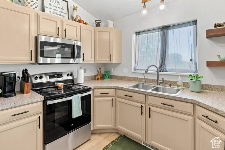 Cream-colored cabinetry with dark hardware