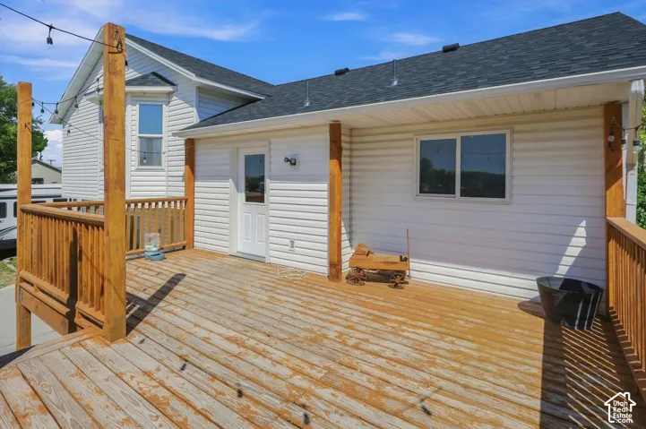 Expansive outdoor deck with wood-finish flooring and railing