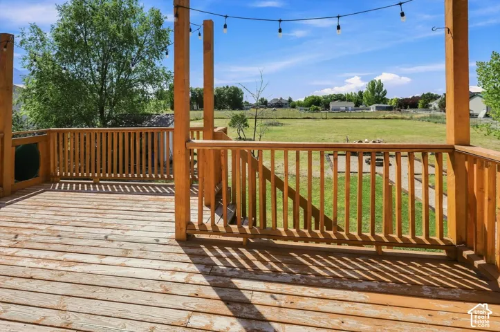 Spacious wooden deck with natural wood railing and posts