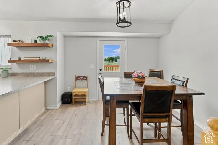 Light wood-finish flooring with a neutral color palette