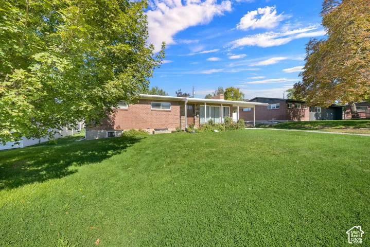 Expansive green lawn with established trees
