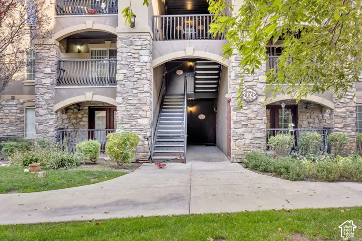 Stacked stone and stucco exterior with multiple private balconies