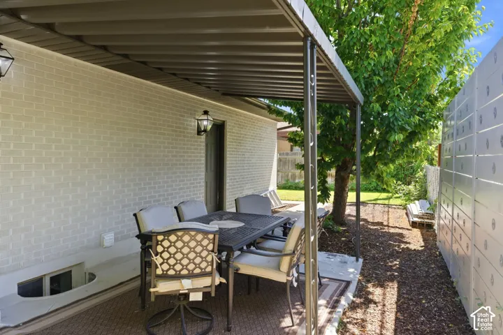 Covered patio featuring a solid roof and recessed lighting
