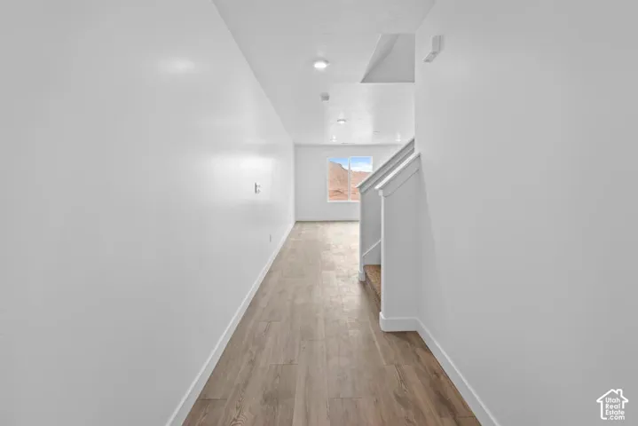 Wood-finish flooring with white wall finishes
