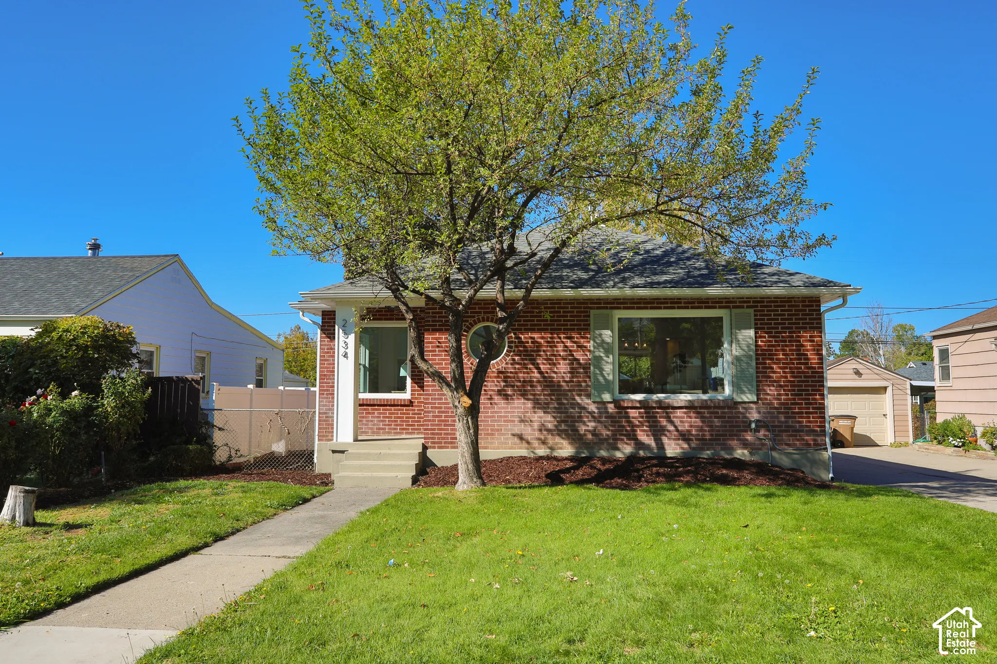 Charming brick residence featuring a welcoming front fa