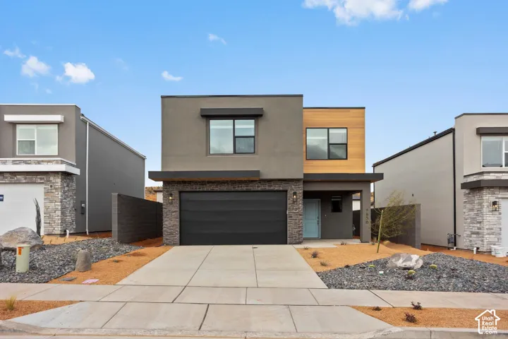 Modern architectural design featuring a multi-level facade with contrasting stone and warm-toned cladding accents