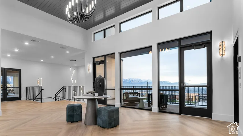 Soaring ceilings with decorative lighting fixtures