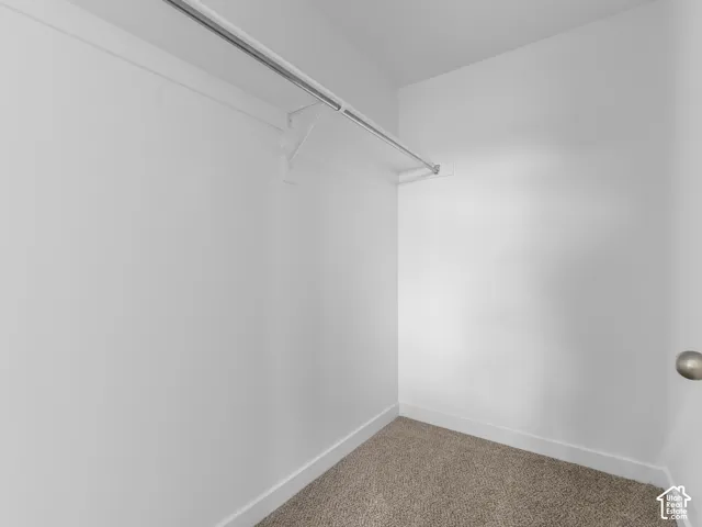 White painted walls with a built-in metal hanging rod
