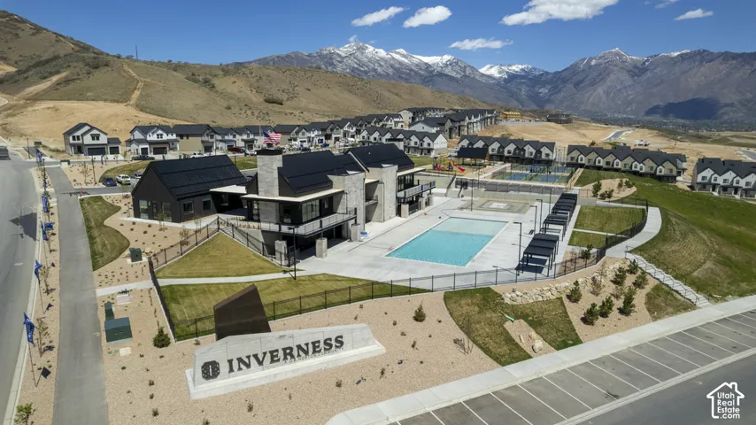 Community amenities featuring a swimming pool, clubhouse, and paved pathways