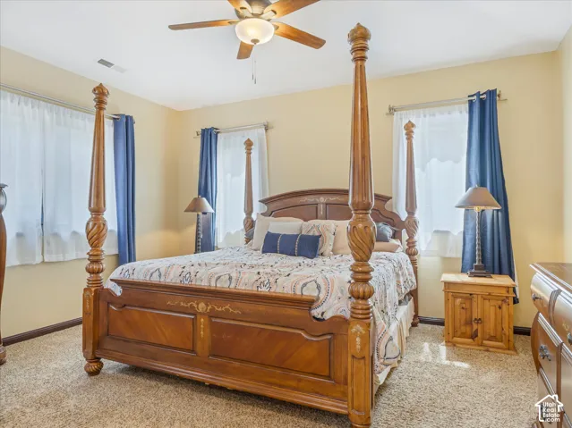 Recessed lighting, ceiling fan, and carpeted flooring