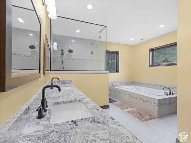 Dual vanity with stone countertop and matte black fixtures
