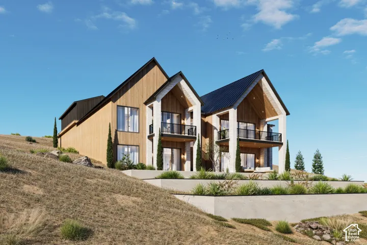 Modern architectural design featuring prominent gables and a dark metal roof