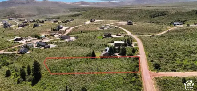Expansive parcel featuring natural vegetation and surrounding residences