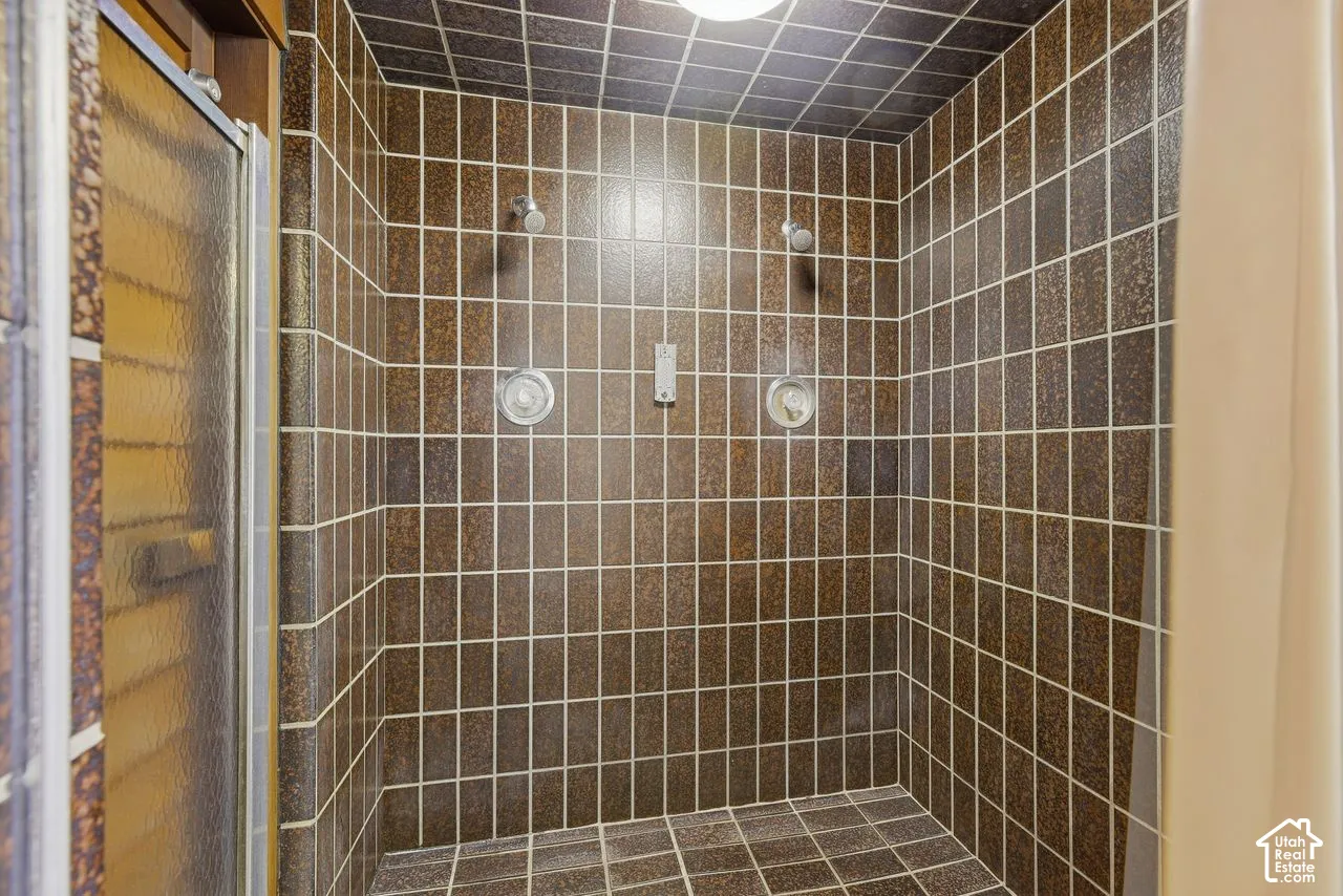 Pool area, Tiled shower, dual shower heads, and dual control valves