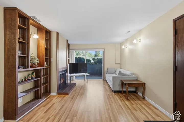 All new Laminate flooring, built-in shelving, gas fireplace, sliding glass door,