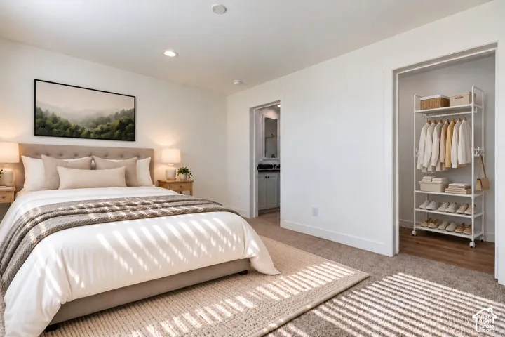 Recessed ceiling lighting, plush carpet flooring, and a neutral color palette