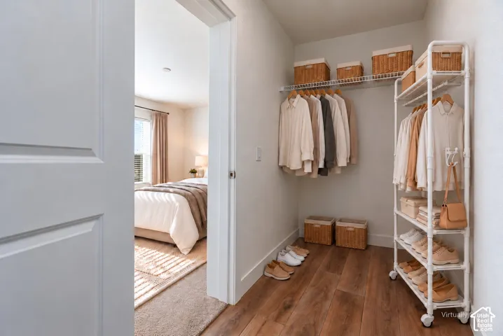 Recessed closet with wood-finish flooring and integrated wire shelving