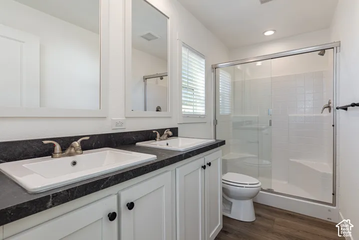 Primary Bedroom Bath Dual vanity with rectangular undermount sinks, dark countertop, and brushed nickel faucets