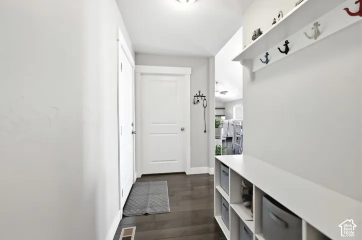 Dark wood-finish flooring with white trim