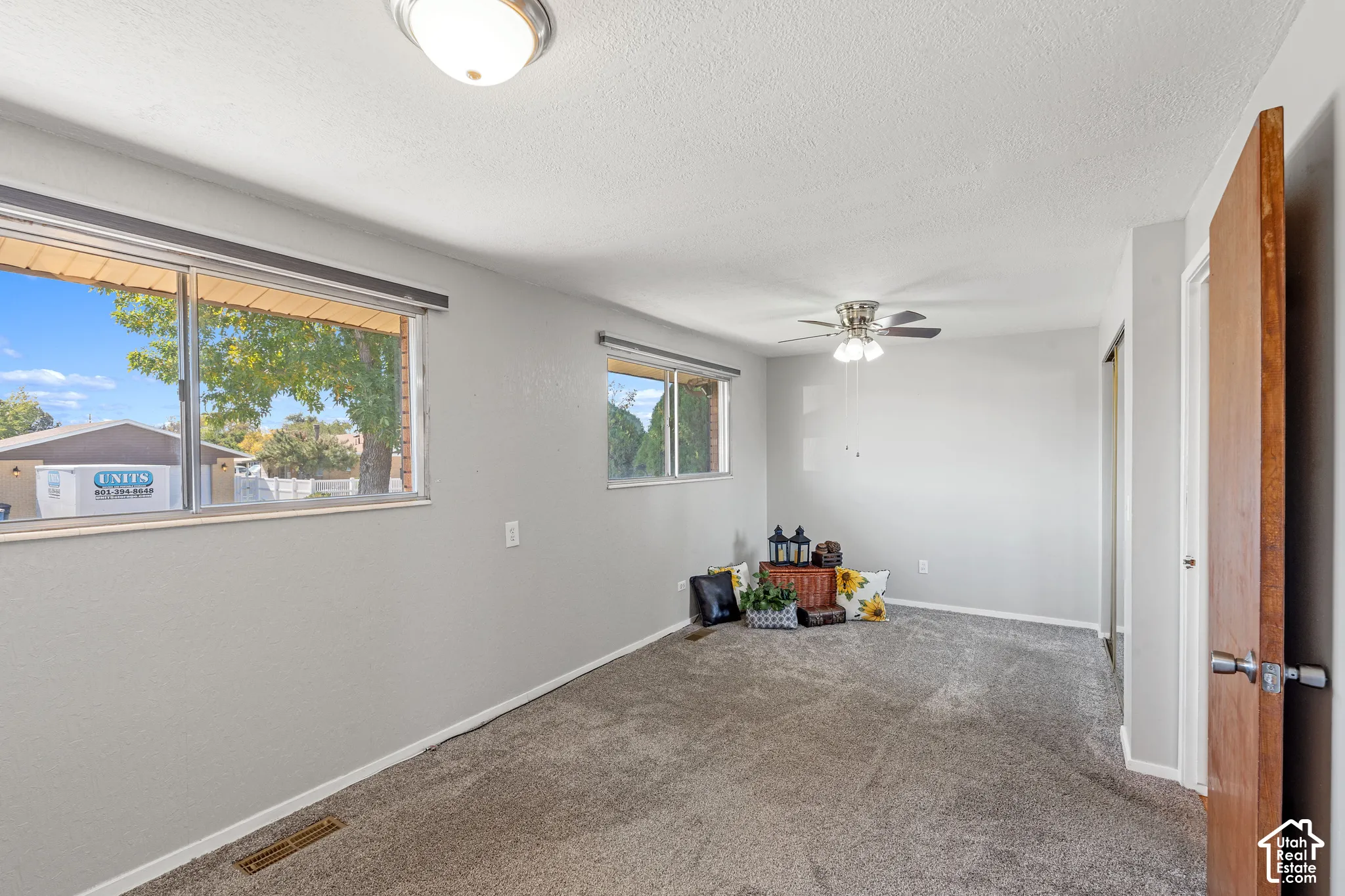Recessed lighting, ceiling fan, and light gray walls