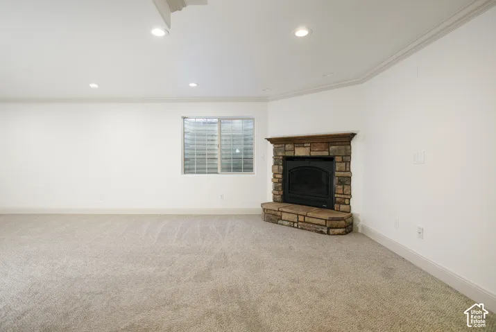 Corner fireplace with stone surround and wood mantel