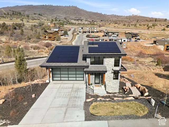 Modern architectural design featuring stone and siding exterior