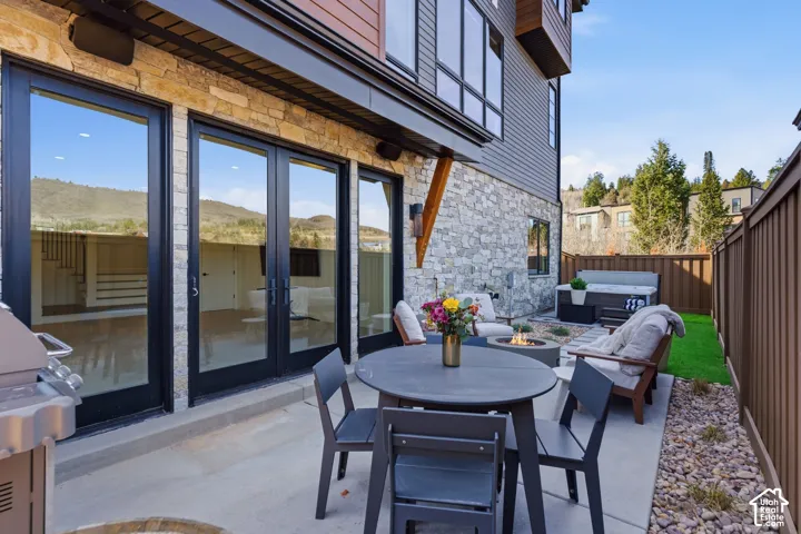 Stone veneer exterior with wood siding accents