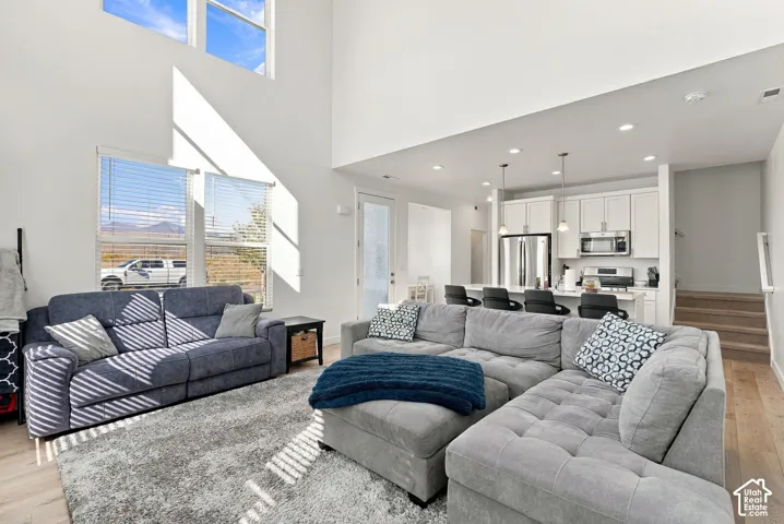 Expansive great room with soaring ceilings and upper transom windows