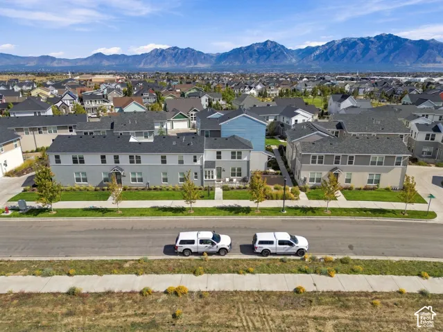 Newly constructed homes with modern architectural design and clean-lined exteriors featuring light-colored siding and dark roofing
