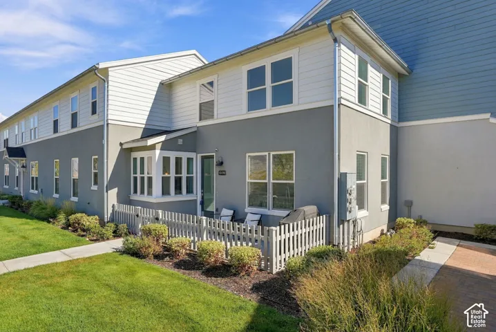Multi-level exterior featuring stucco and siding finishes