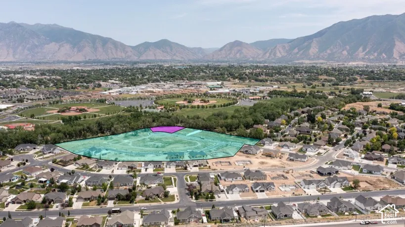 Aerial perspective showcasing residential development with established homes and new construction