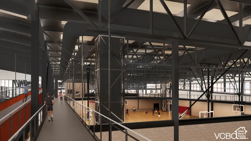 Expansive athletic facility with multi-level track, hardwood court, and exposed structural beams