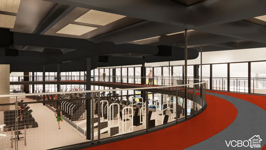 Multi-level fitness facility featuring an indoor running track, exposed ceiling ductwork, expansive window walls, and durable flooring