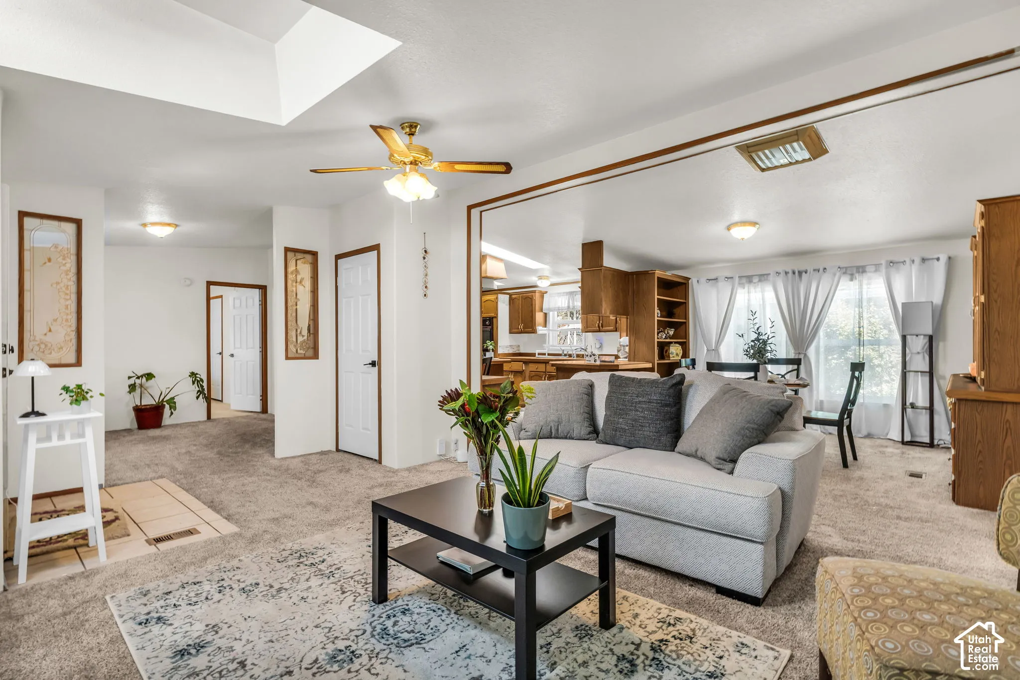 Recessed lighting, wood-finish trim, ceiling fan, and carpeted flooring