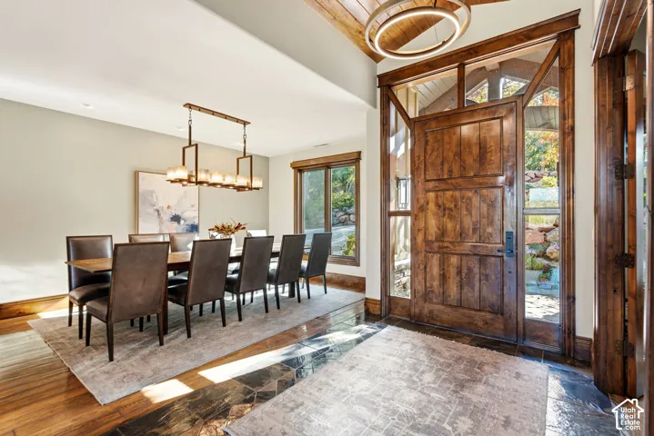 Grand entry with a wood-finish door, sidelights, and transom windows