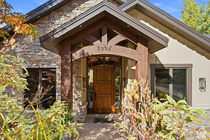Stone and board-and-batten exterior with a gabled roofline