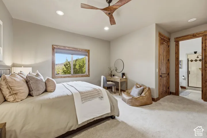 Textured wood-finish door and door frame, recessed lighting, wood-finish ceiling fan, and light-toned carpeting