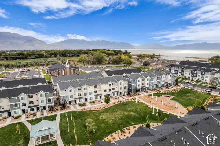 Expansive community green space with a gazebo and paved pathways