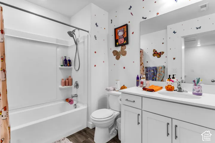 White vanity with a single basin sink and white cabinetry