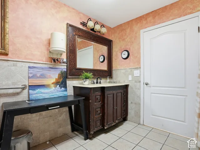 Tile flooring with a coordinating tile wainscoting