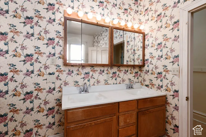 Dual medicine cabinets, double vanity with integrated sinks, and ample under-sink storage