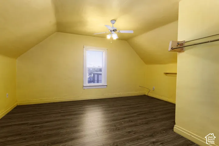 Vaulted ceilings, wood-finish flooring, ceiling fan with integrated lighting, single window