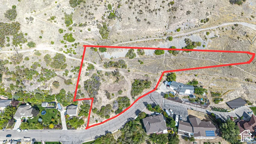 Expansive undeveloped lot featuring varied topography and natural vegetation
