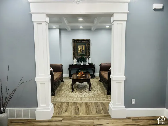 Entry to Formal Living Room framed by stately craftsman-style columns.