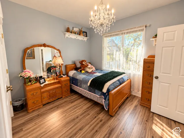 Bright bedroom with a crystal chandelier, connected to a Jack-and-Jill bath.