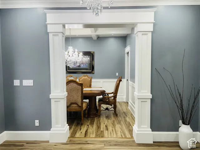 Entry to Formal Dining Room framed by stately craftsman-style columns.