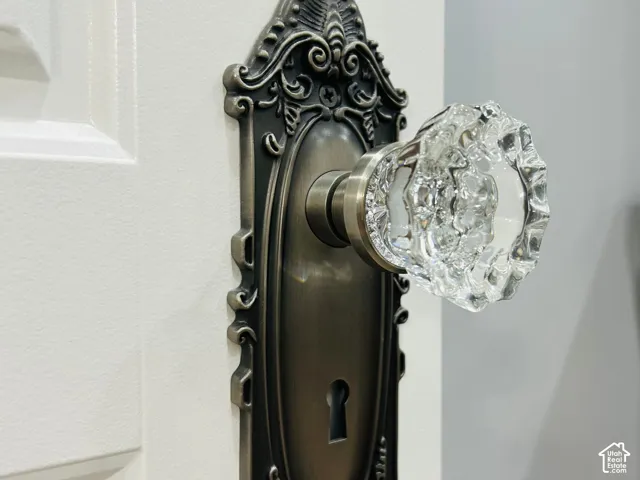 Vintage-style crystal doorknobs with ornate backplates add a timeless touch throughoutthe home.