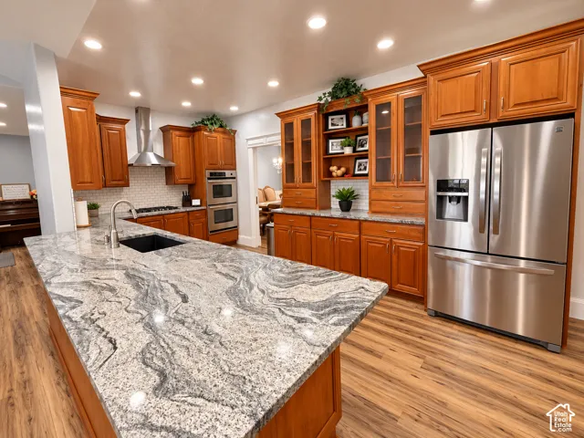 Expansive kitchen island with a patterned countertop and undermount sink