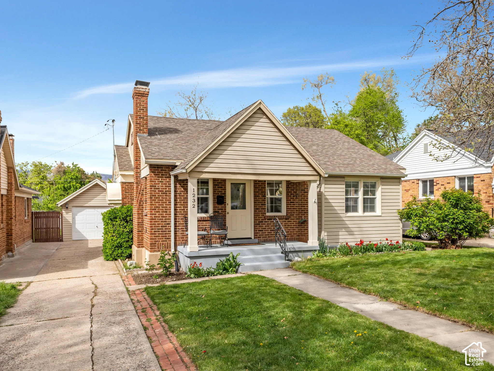 Brick and siding exterior with a covered front porch